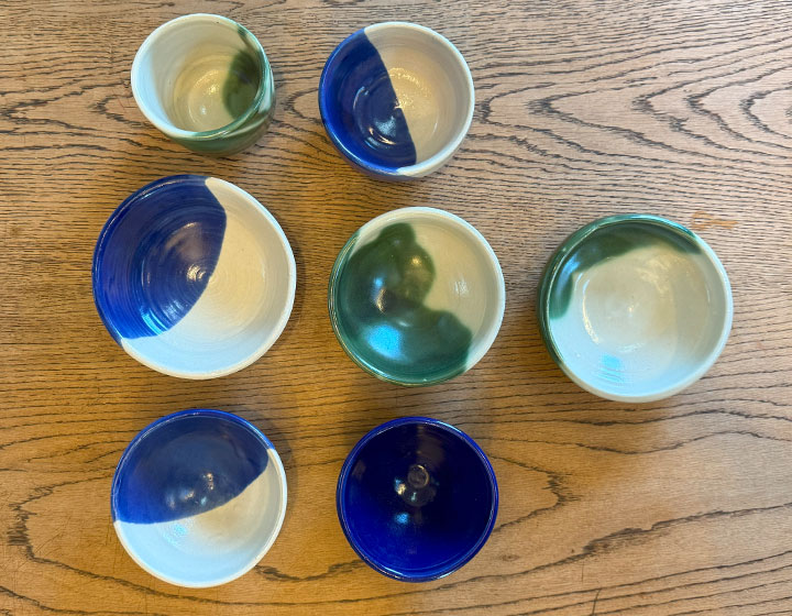 The warm, earthy texture of the white base is beautifully complemented by the harmonious green and vibrant blue! class=