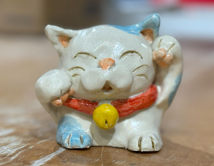 This is a secret, but I did take inspiration from Doraemon's coloring. When it comes to Japanese cats, it's Hello Kitty and him, right?